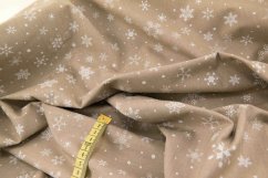 Cotton canvas - white flakes on a beige background - width 150 cm