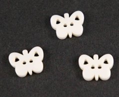 Motýlik - knoflík  - tmavo biela - rozmery 1 cm x 1,3 cm