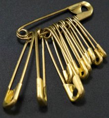 Safety pins - a mixture of small gold