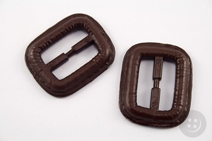 Plastic clothing buckle - brown - pulling hole width 2,5 cm - dimensions 3,8 cm x 3,2 cm