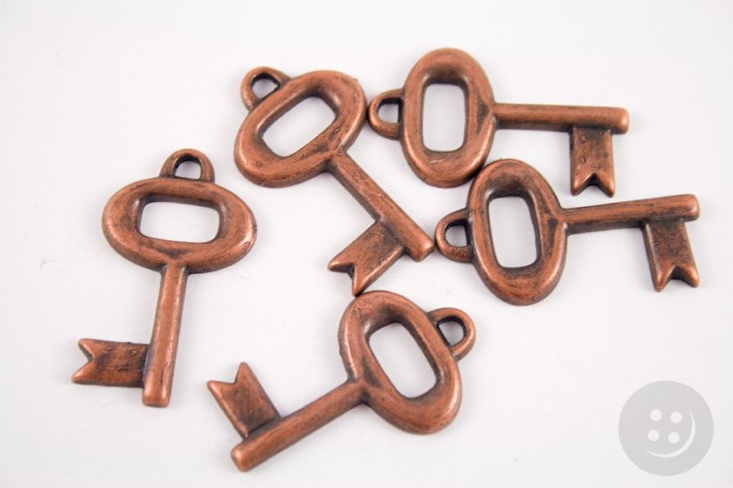Key shaped clothing decoration - antique copper - diameter 1,2 cm