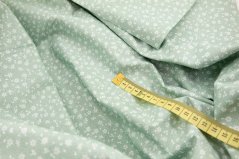 Baumwollstoff - weiße Blümchen auf grünem Untergrund - Breite 160 cm