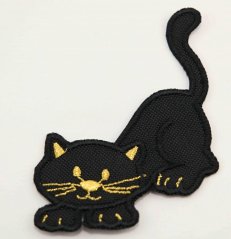 Iron-on patch - black cat with gold decorations, lurking - size 7 cm x 9.5 cm