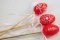 Small eggs with hearts and flowers on a stick - red, white