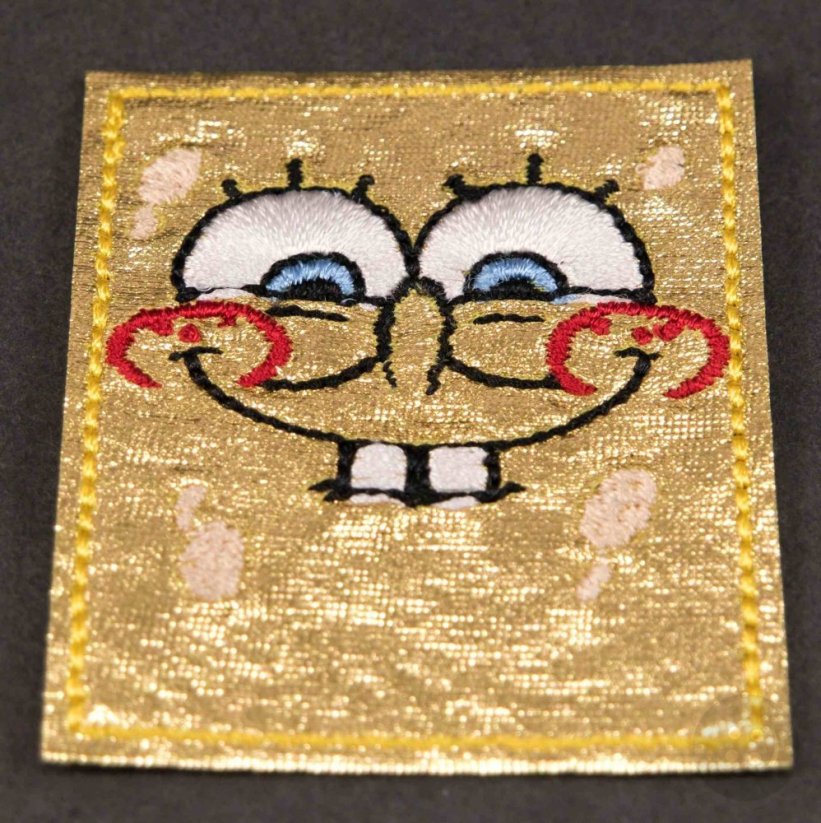 Nažehlovací záplata - Spongebob úsměv - rozměr 5,2 cm x 4,5 cm