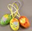 Easter eggs with chickens and bow - orange, green, yellow