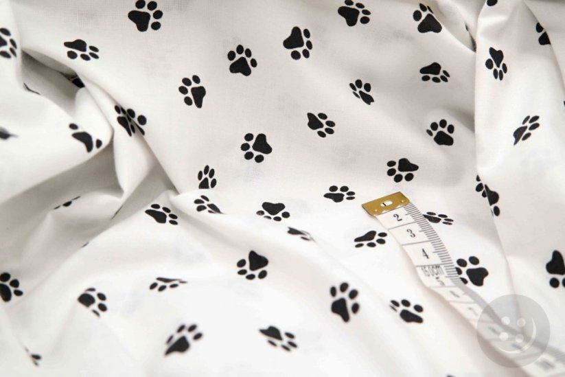 Cotton canvas - black paws on a white background - width 160 cm