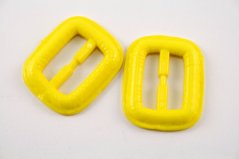 Plastic clothing buckle - yellow - pulling hole width 2,5 cm - dimensions 3,8 cm x 3,2 cm