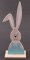 Wooden Easter bunny with ears on a pedestal - size 17.5 cm x 4.5 cm x 3.5 cm - light blue, light wood, black