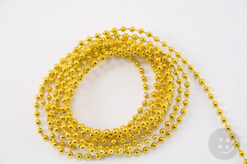 Beads threaded on a cord - gold - diameter 0.3 cm