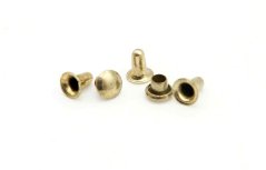 Goldfarbene Niete, Länge 0,5 cm Goldfarbene Niete, Länge 0,5 cm