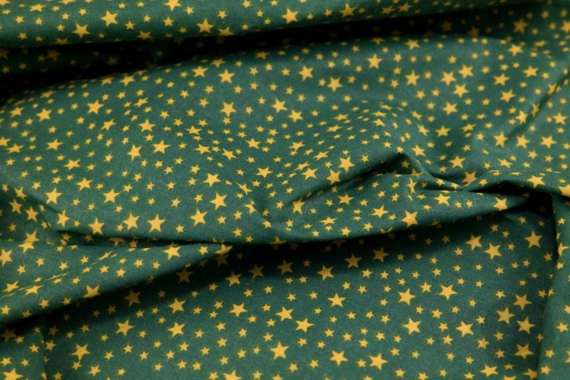 Bavlněné plátno - žluté hvězdičky na zeleném podkladu - šířka 140 cm