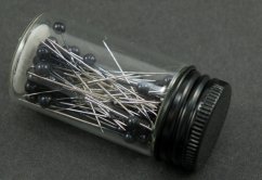 Decorative pins in a glass bottle - black head