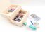 Natural foldable sewing box with sewing supplies