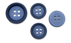 Dark blue suit button with matte surface and mother-of-pearl center