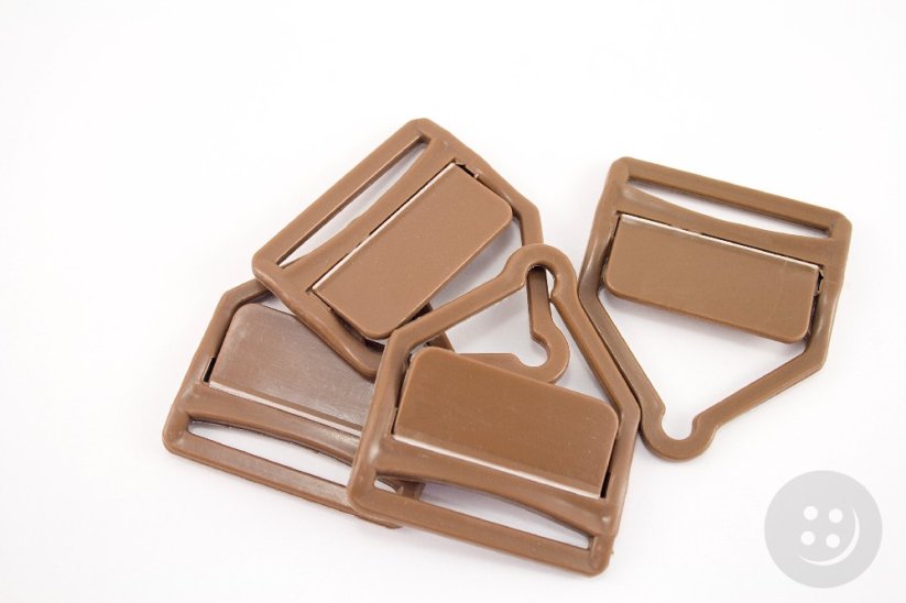 Plastic overalls buckle - brown - pulling hole width 3,5 cm
