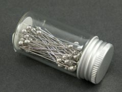 Decorative pins in a glass bottle - silver head