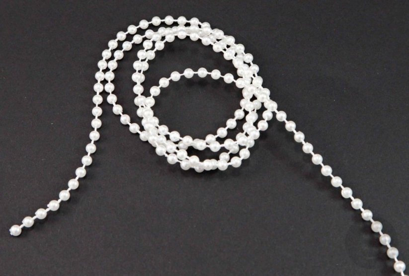 Beads threaded on a cord - white - diameter 0.3 cm