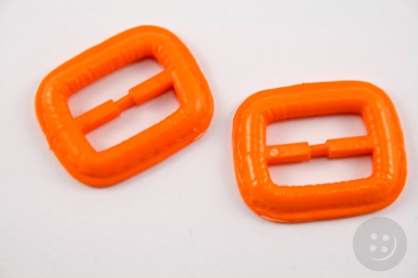 Plastic clothing buckle - orange - pulling hole width 2,5 cm - dimensions 3,8 cm x 3,2 cm